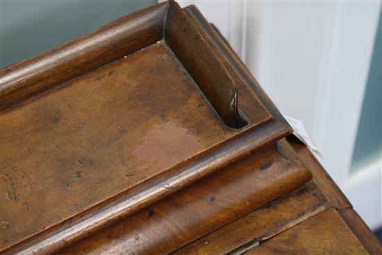 A late Victorian walnut davenport W.56cm